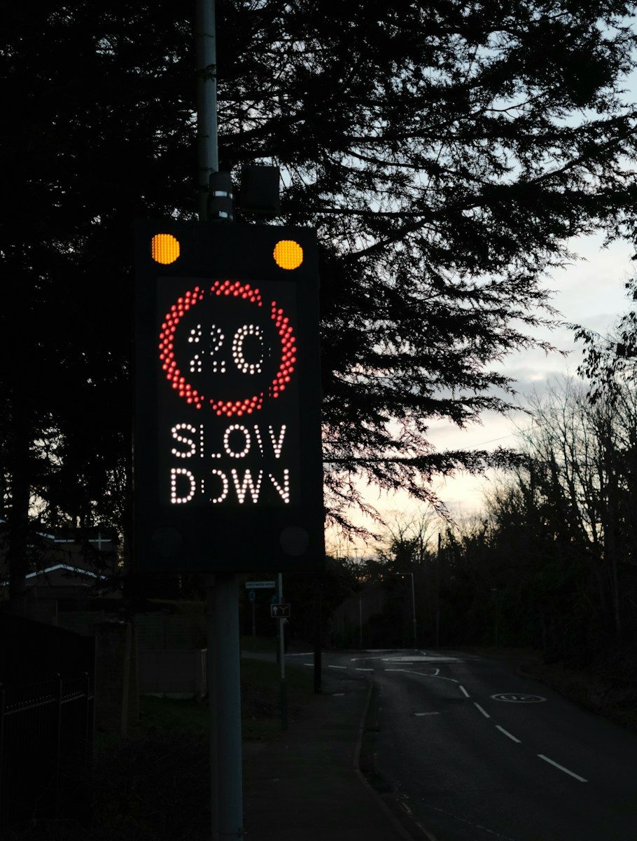 a street sign on a pole on the side of the road
